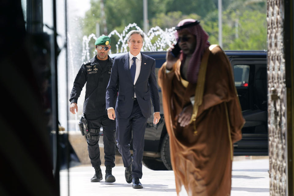 U.S. Secretary of State Antony Blinken, center, arrives to meet with Saudi Foreign Minister Prince Faisal Bin Farhan, at the Ministry of Foreign Affairs in Riyadh, Saudi Arabia, Saturday Oct. 14, 2023. (AP Photo/Jacquelyn Martin, Pool)