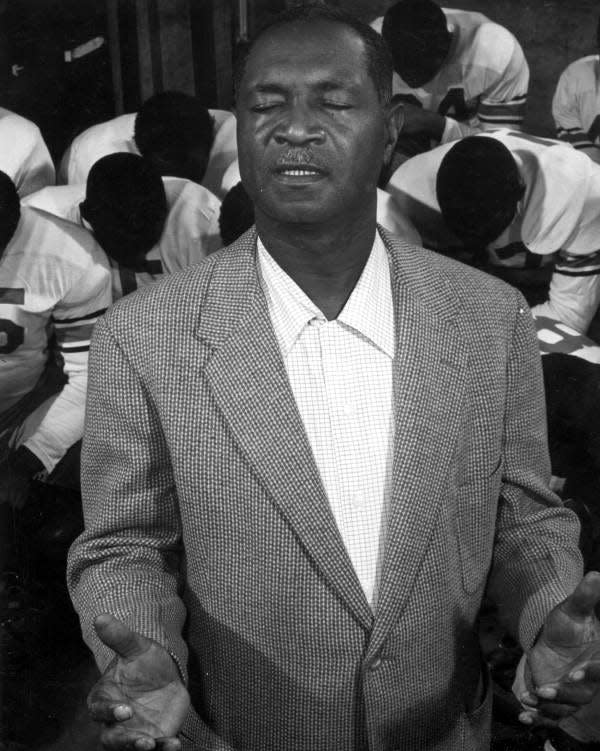 Coach "Jake" Gaither and his FAMU football team praying in this undated photo taken in Tallahassee, Florida.