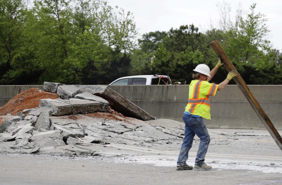 Construction crews work on a section of Interstate 20 West that buckled in Decatur, Ga., Monday, April 17, 2017. (AP Photo/David Goldman)