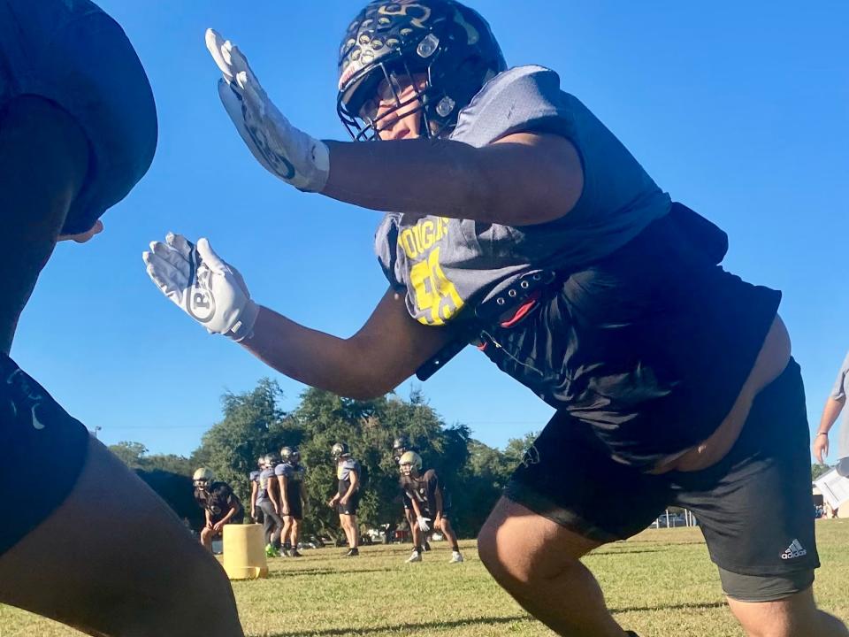 Crockett lineman Amado Peña-Gonzalez takes on blockers at football practice. The Cougar senior made the all-district team last year as a junior.