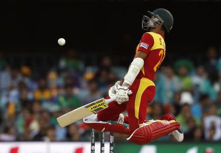 Zimbabwe's Sikandar Raza avoids a short delivery from Pakistan's Mohammad Irfan during their Cricket World Cup match at the Gabba in Brisbane March 1, 2015. REUTERS/Jason Reed