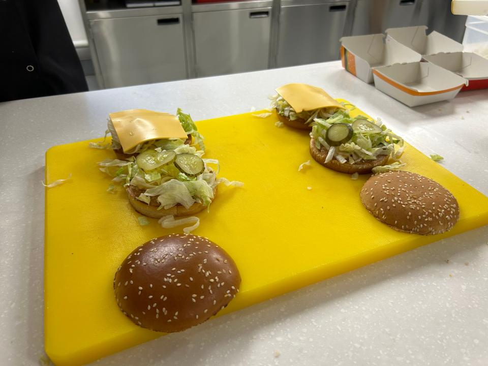 Two Big Macs laid out side by side. The buns have been removed to illustrate the toppings.