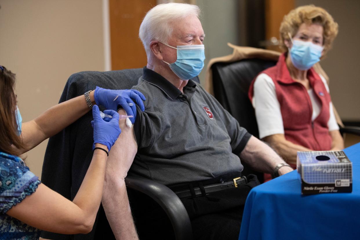 Stacy Wilson, an RN with the Wilson County Health Department inoculates former Gov. Jim Hunt and his wife Carolyn with their first dose of the Moderna COVID-19 vaccine at the Wilson County Health Department on Wednesday, Jan. 6, 2021, in Wilson, N.C. They will return in 28 days for the second dose of the vaccine.