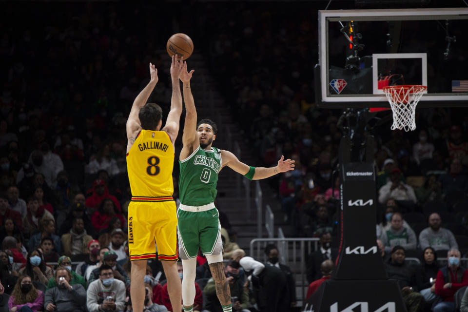 Atlanta Hawks forward Danilo Gallinari (8) shoots over Boston Celtics forward Jayson Tatum (0) during the first half of an NBA basketball game Friday, Jan. 28, 2022, in Atlanta. (AP Photo/Hakim Wright Sr.)