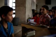 Children studying Quran at a mosques in al-Kalasa district of Aleppo July 16, 2017. REUTERS/ Omar Sanadiki