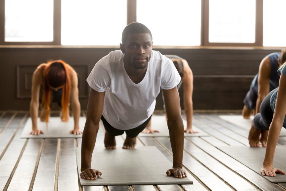 <p>If you think you're too manly for yoga, we have some bad news: You're already doing it.</p><p>Those planks you add to every core session? Yoga. That stretch before your pickup game? Yoga. The deep breaths you take to center yourself when you're stressed? Yoga. If you think a style of exercise should be gendered, you should probably find yourself some way to travel back in time, because that's the only place those types of rigid, restrictive ideas still exist.</p><p>Yoga can be extremely beneficial for everyone - but <a rel="nofollow noopener" href="https://www.menshealth.com/health/a19546955/benefits-of-yoga-for-men/" target="_blank" data-ylk="slk:especially for men;elm:context_link;itc:0;sec:content-canvas" class="link ">especially for men</a>. Taking one yoga class per week or doing a couple of pre-workout poses can increase endurance, build strength, prevent injuries, and may even stave off heart disease. </p><p>How? “Men often suffer from tightness particularly in the hips, hamstrings, and shoulders that can lead to injury or weakness,” Baron Baptiste, creator of Baptiste Power Vinyasa Yoga and former assistant coach with the Philadelphia Eagles told <em>MensHealth.com</em>. “Over-training in any one sport can cause repetitive stress and other more serious injuries. Yoga is a full-body workout that creates both strength and flexibility. You need to have both. One without the other is a recipe for disaster.”</p><p> Not sure where to start with your brand new commitment to yoga? Practice these 10 poses in this order, which Baptiste claimed can benefit men because they stretch out guys’ tightest spots (like the shoulders, hips, and groin) and strengthen muscles that get no love during workouts (like the low back and knees).</p>