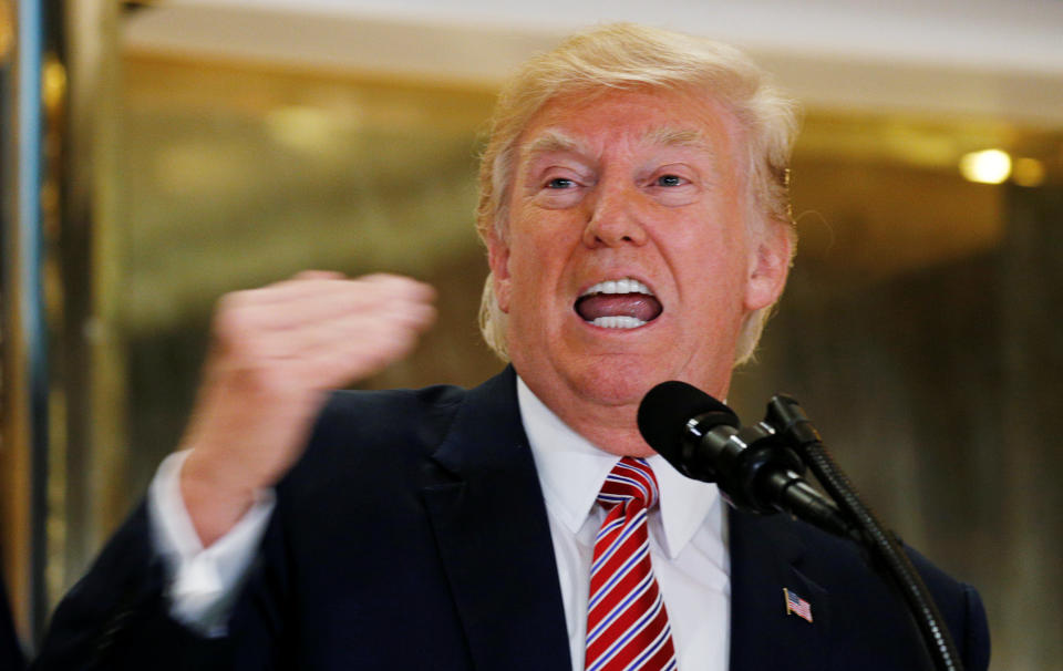 President Donald Trump defiantly answers questions about his responses to the violence at the "Unite the Right" rally in Charlottesville on Aug. 15. (Photo: Kevin Lamarque / Reuters)