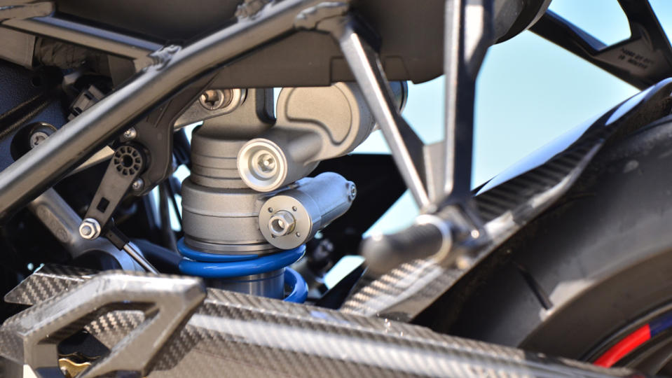 A close-up of the rear shock on the BMW M 1000 R M Competition motorcycle.