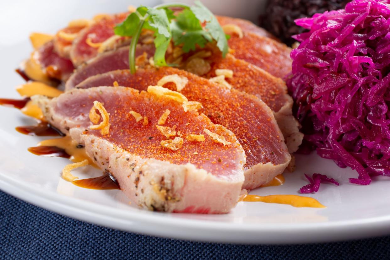 A view of a plate of seared tuna.