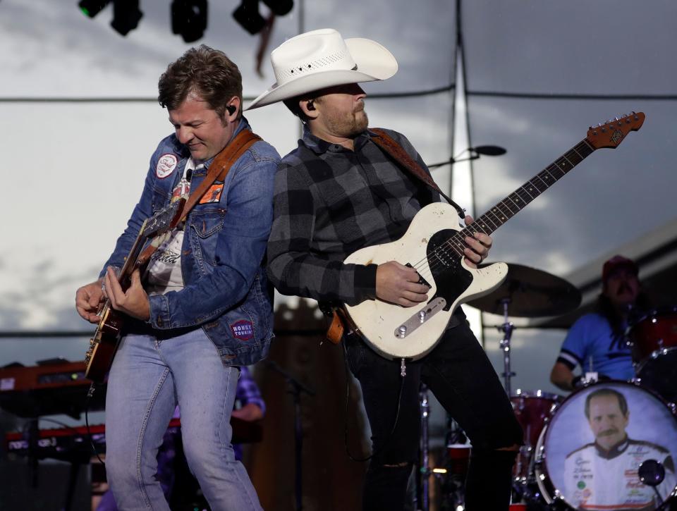 Country musician Justin Moore, right, with band member Roger Coleman perform at Resch Plaza on July 12, 2023, in Ashwaubenon, Wis.