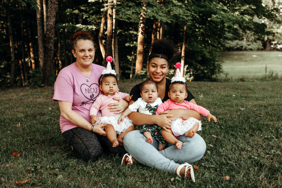 Katrina Mullen with Shariya Small and the triplets,  Serenitee, Samari, and Sarayah. The nurse knew the teen mom just needed 'a safe place to put roots.' (Dustin + Bree Photography)