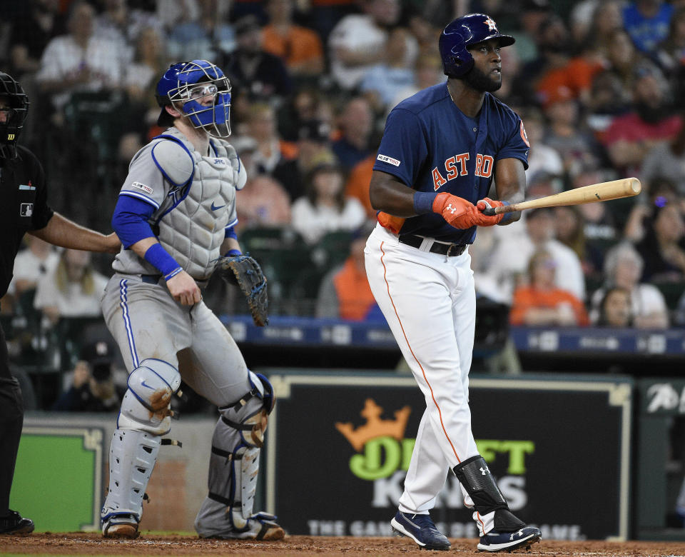 Houston Astros' Yordan Alvarez, right, watches his solo home run off Toronto Blue Jays starting pitcher Clayton Richard during the third inning of a baseball game, Saturday, June 15, 2019, in Houston. (AP Photo/Eric Christian Smith)