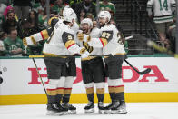 Vegas Golden Knights' Jack Eichel (9), Jonathan Marchessault, center, Shea Theodore (27) and a teammate celebrate after Marchessault scored against the Dallas Stars duirng the second period of Game 4 of the NHL hockey Stanley Cup Western Conference finals Thursday, May 25, 2023, in Dallas. (AP Photo/Tony Gutierrez)