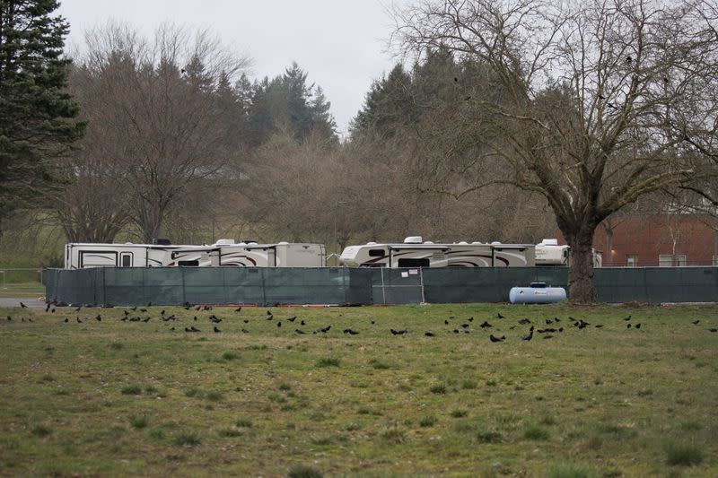Recreational vehicles (RVs) are seen parked in a earmarked quarantine site for healthy people potentially exposed to novel coronavirus, behind Washington State Public Health Laboratories in Shoreline, north of Seattle