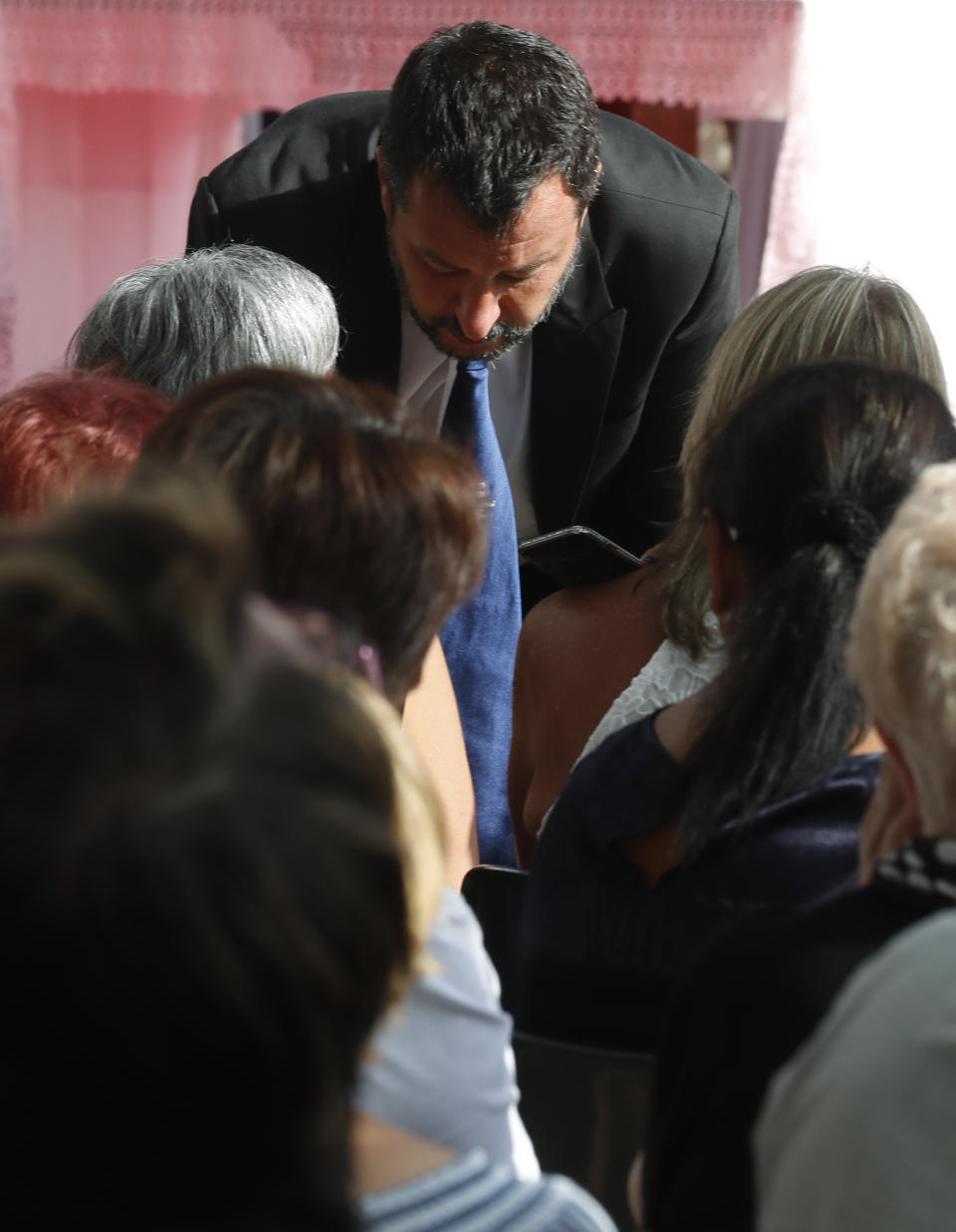 Italian Interior Minister Matteo Salvini attends a remembrance ceremony to mark the first anniversary of the Morandi bridge collapse, in Genoa, Italy, Wednesday, Aug. 14, 2019. The Morandi bridge was a road viaduct on the A10 motorway in Genoa, that collapsed one year ago killing 43 people. (AP Photo/Antonio Calanni)