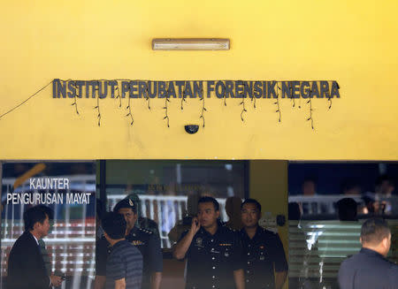 Police officers stand outside the Kuala Lumpur Hospital where the body of Kim Jong Nam is held for autopsy, in Putrajaya, Malaysia February 15, 2017. REUTERS/Edgar Su