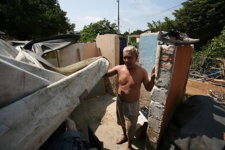 A man stands inside of what his left of his home after an earthquake struck the southern coast of Mexico late on Thursday, in Union Hidalgo, Mexico September 9, 2017. REUTERS/Jorge Luis Plata