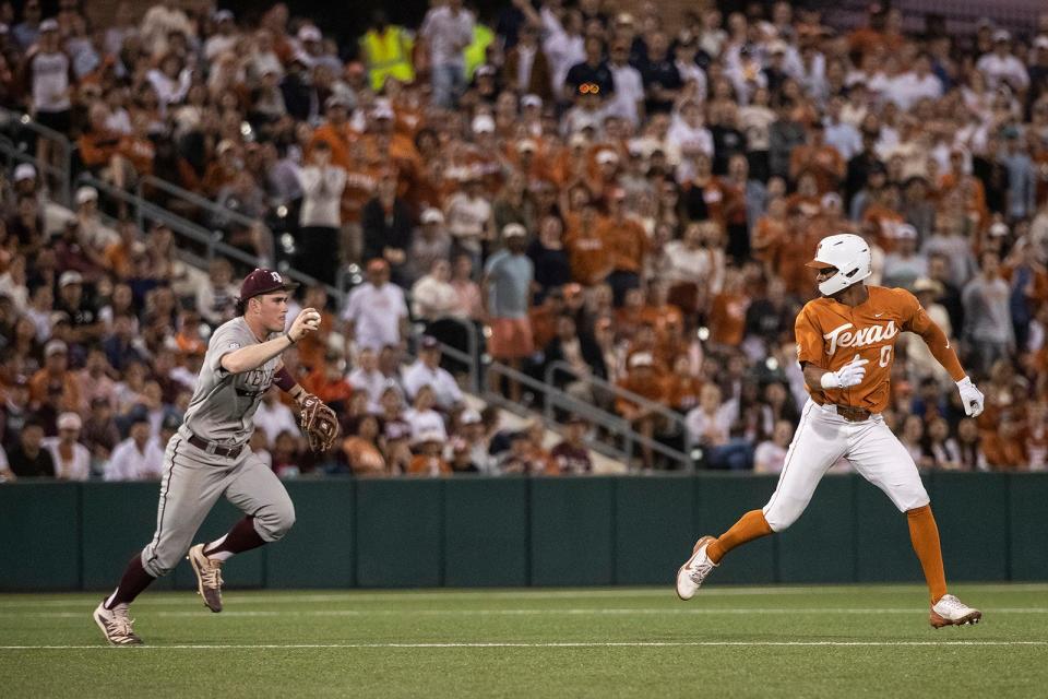 Texas' Trey Faltine is chased by A&M third baseman Ryan Targac at Disch-Falk Field in March 2022. The Aggies and Longhorns have played each other nine times in the past eight years.