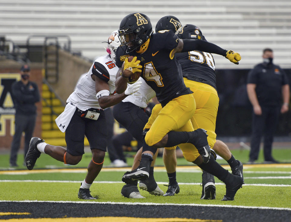 Appalachian St. running back Daetrich Harrington scores on a run during the second half of an NCAA college football game against Campbell, Saturday, Sept. 26, 2020 at Kidd Brewer Stadium in Boone, N.C. (Walt Unks/The Winston-Salem Journal via AP)