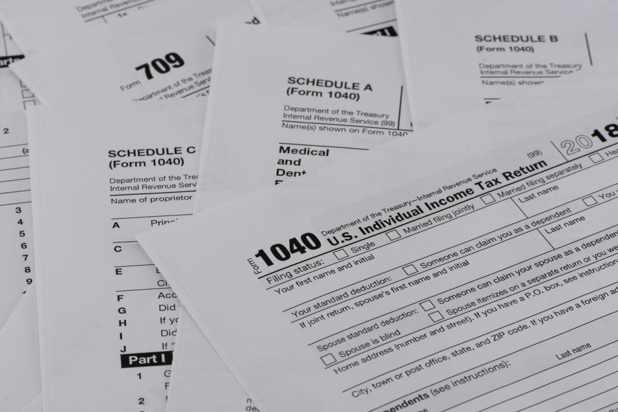 Various pages of the US IRS tax return forms with business tools