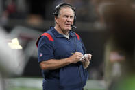 New England Patriots head coach Bill Belichick watches play against the Atlanta Falcons during the first half of an NFL football game, Thursday, Nov. 18, 2021, in Atlanta. (AP Photo/Brynn Anderson)