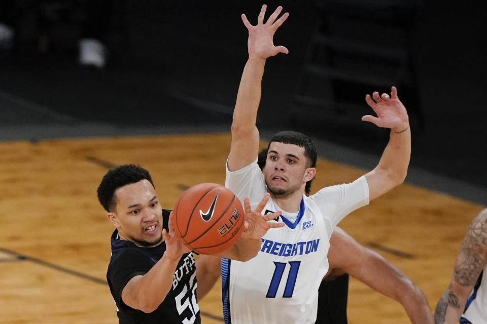 Butler's Jair Bolden, left, passes the ball away from Creighton's Marcus Zegarowski during the second half of an NCAA college basketball game in the Big East men's tournament Thursday, March 11, 2021, in New York. (AP Photo/Frank Franklin II)