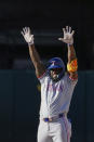 Texas Rangers' Adolis García reacts after hitting an RBI double against the Oakland Athletics during the eighth inning in the second baseball game of a doubleheader Wednesday, May 8, 2024, in Oakland, Calif. (AP Photo/Godofredo A. Vásquez)