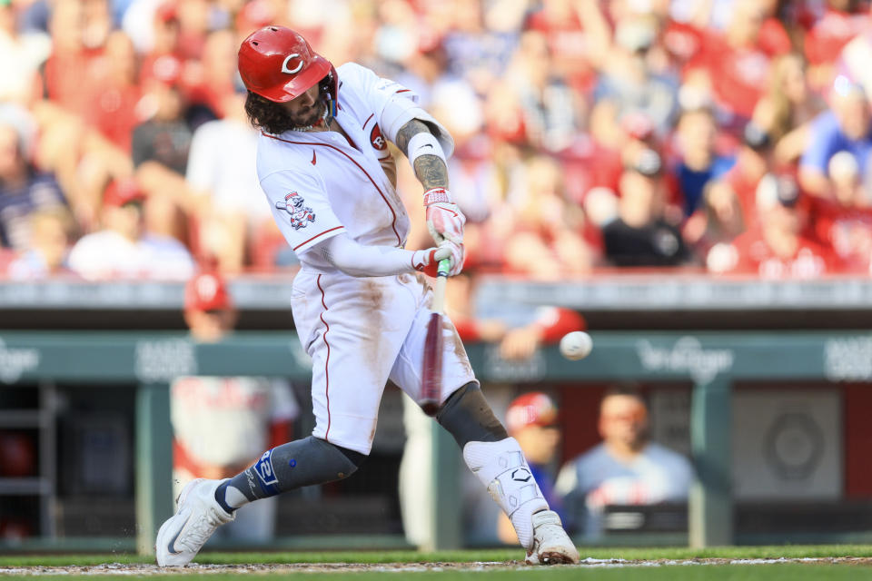 Cincinnati Reds' Jonathan India hits an RBI-double during the fourth inning of a baseball game against the Philadelphia Phillies in Cincinnati, Saturday, April 15, 2023. (AP Photo/Aaron Doster)