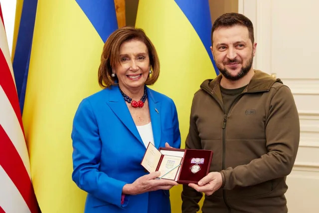 In this image released by the Ukrainian Presidential Press Office on Sunday, May 1, 2022, Ukrainian President Volodymyr Zelenskyy, right, awards the Order of Princess Olga, the third grade, to U.S. Speaker of the House Nancy Pelosi in Kyiv, Ukraine, Saturday, April 30, 2022. (AP)