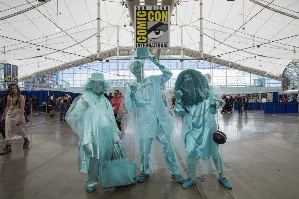 Haunted Mansion cosplayers.