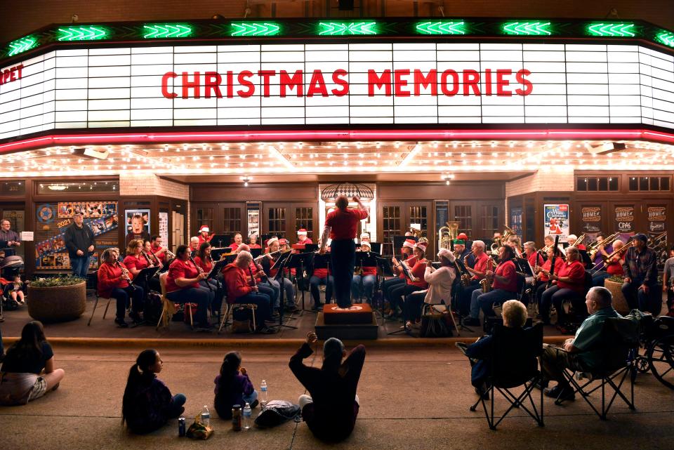 The Abilene Community Band performs its City Sidewalks concert in front of the Paramount Theatre, and will again this year.