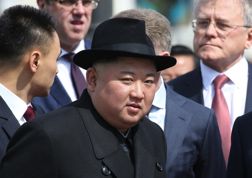 watches an honor guard before his departure to North Korea at the railway station in Vladivostok, Russia, on Friday, April 26, 2019. 