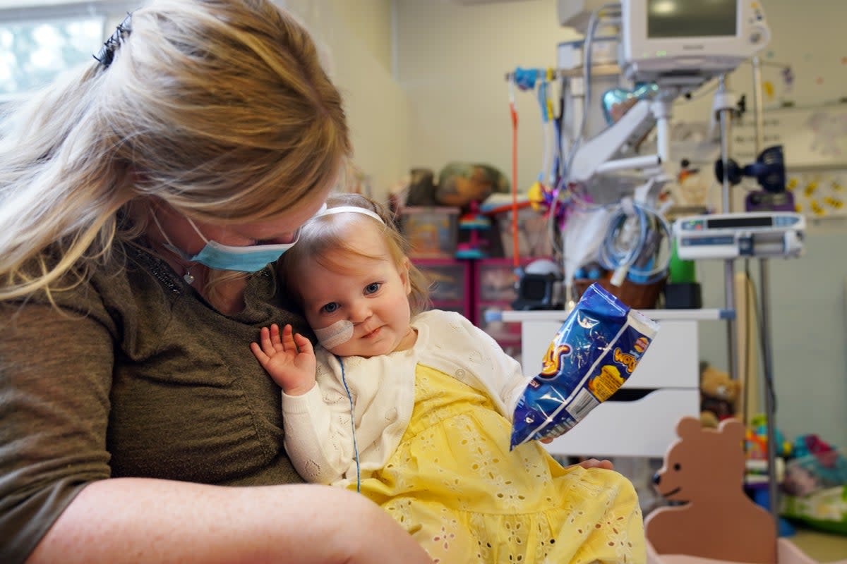 Cheryl Adamson with her 18-month-old daughter Beatrix Adamson-Archbold at the Freeman Hospital in High Heaton, Newcastle Upon Tyne (Owen Humphreys/PA) (PA Wire)