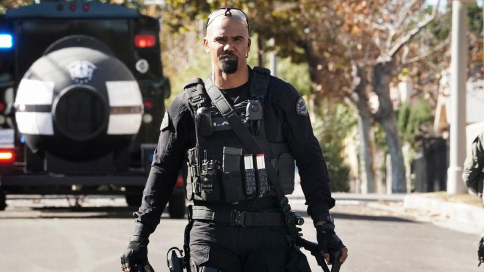 Shemar Moore walking toward the camera in SWAT gear on S.W.A.T.