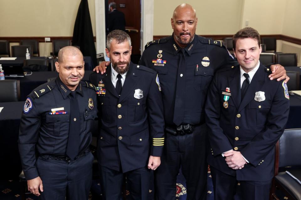 Police officers including Daniel Hodges and Michael Fanone appear before Congress to describe their ordeals on 6 January 2021 (AP)