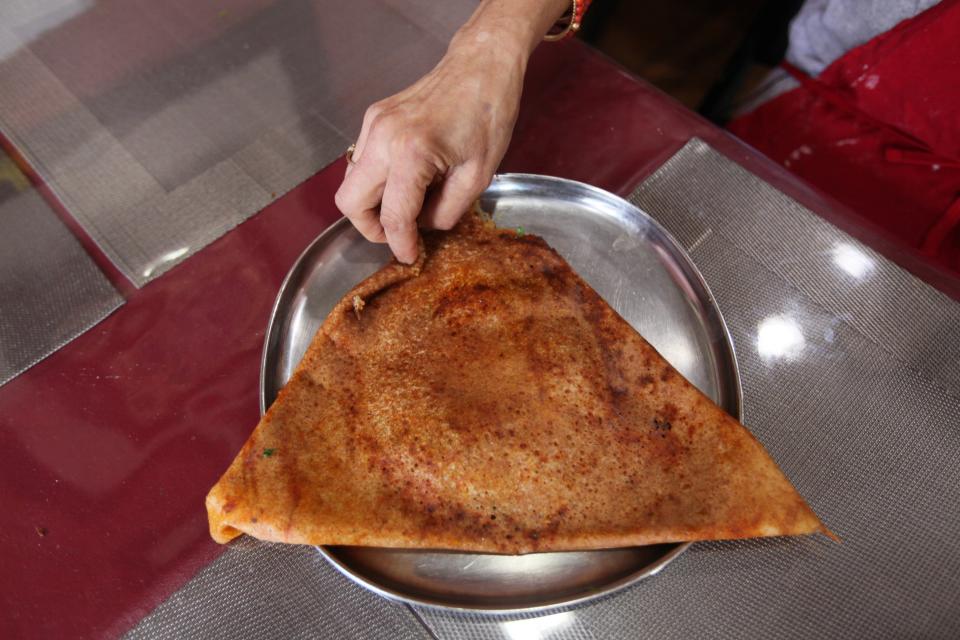Girija Narahari learned to make dosa bread from her mother in India. She and her husband opened Dosa Corner, 1077 Old Henderson Rd., and make dosa bread every day for their customers.