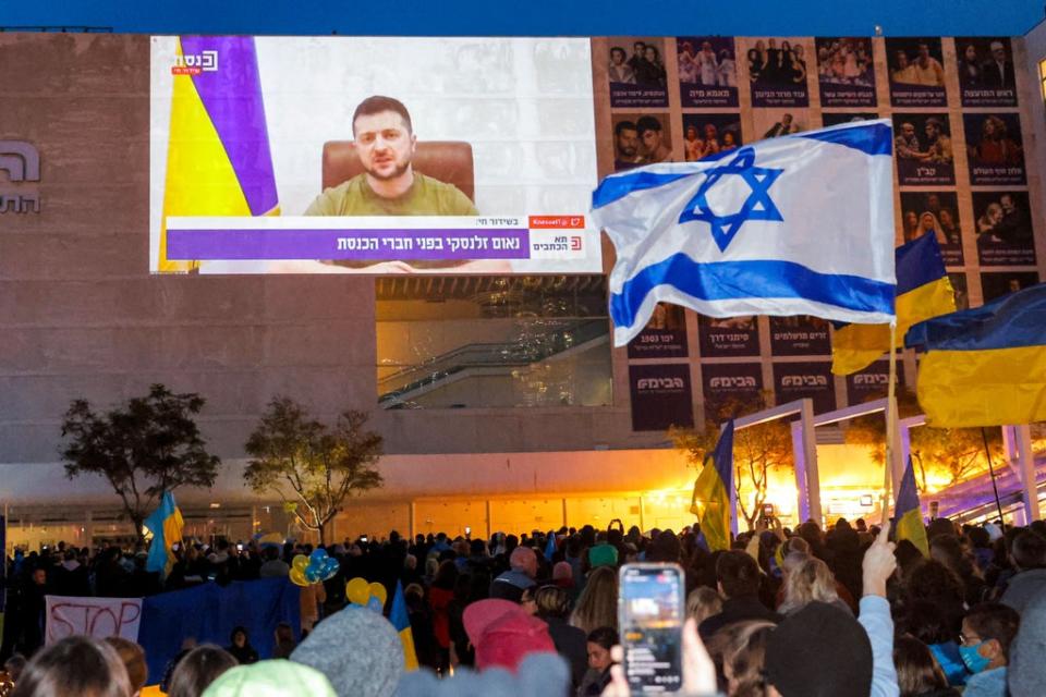 Demonstrators gather in Tel Aviv for a televised video address by Ukraine’s president Volodymyr Zelensky (AFP)