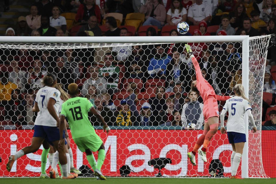 England's goalkeeper Mary Earps, top, saves ball during the Women's World Cup round of 16 soccer match between England and Nigeria in Brisbane, Australia, Monday, Aug. 7, 2023. (AP Photo/Tertius Pickard)