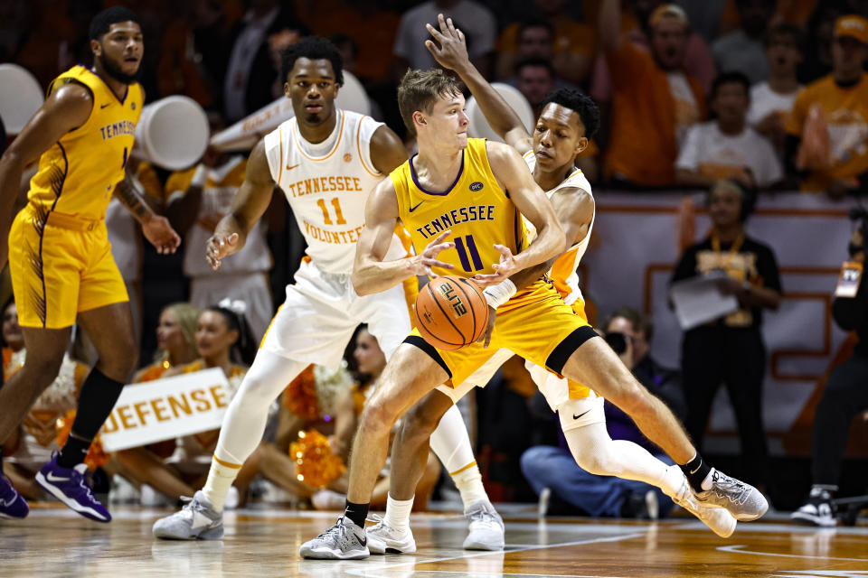 Tennessee guard Jordan Gainey (2) knocks the ball away from Tennessee Tech guard Grant Strong (11) during the first half of an NCAA college basketball game Monday, Nov. 6, 2023, in Knoxville, Tenn. (AP Photo/Wade Payne)