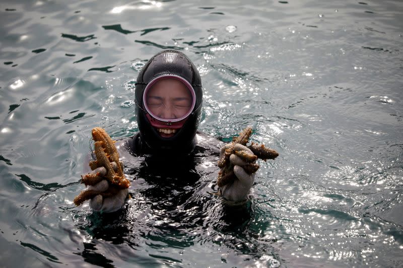 The Wider Image: For South Korea's youngest 'sea women', warming seas mean smaller catches