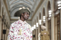 A model wears a creation for the Kenzo fall-winter 22/23 men's collection, in Paris, Sunday, Jan. 23, 2022. (AP Photo/Lewis Joly)