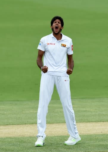 Sri Lanka's Kasun Rajitha celebrates after dismissing Australia's Joe Burns during day two of the second Test in Canberra