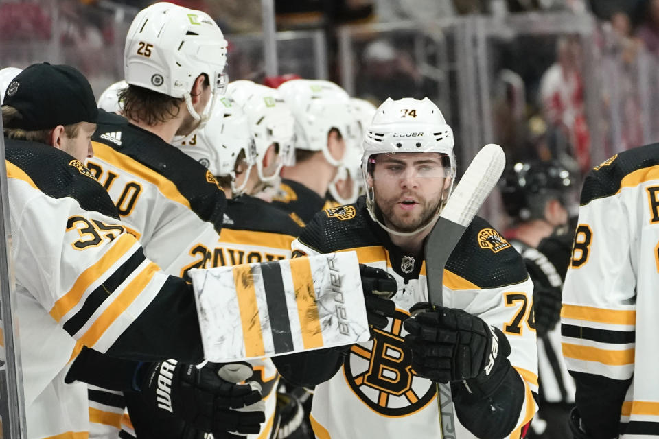 Boston Bruins left wing Jake DeBrusk (74) celebrates his goal against the Detroit Red Wings in the third period of an NHL hockey game Sunday, March 12, 2023, in Detroit. (AP Photo/Paul Sancya)