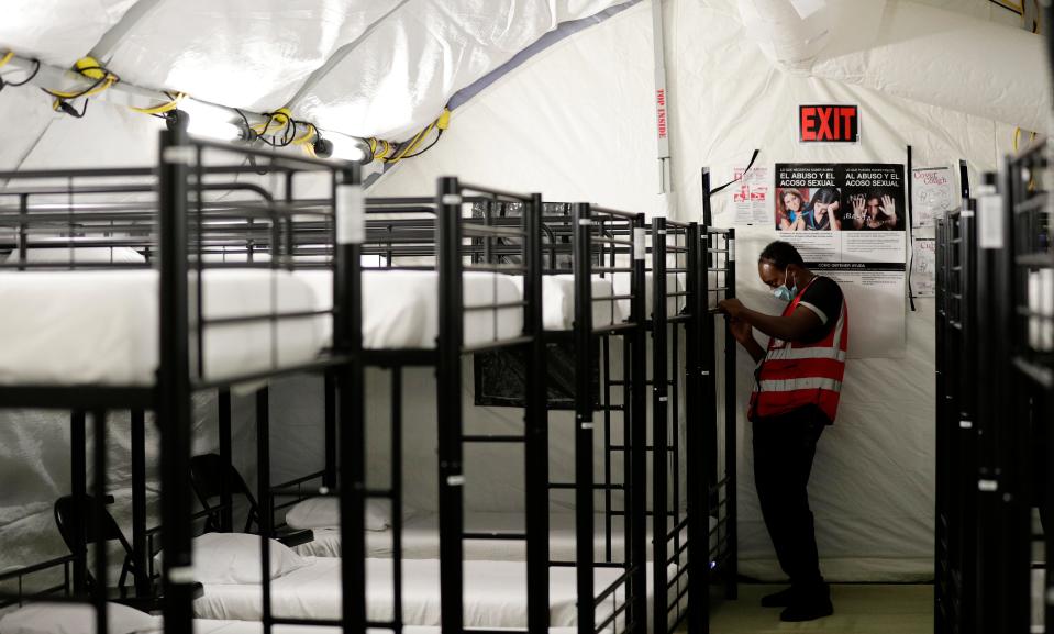 A staff member works in the infirmary, a series of tents, at the U.S. government's newest holding center for migrant children in Carrizo Springs, Texas.