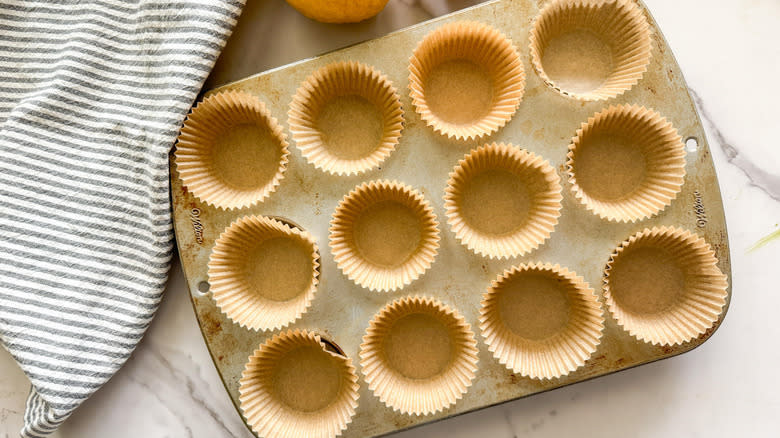 muffin tin with paper cupcake liners
