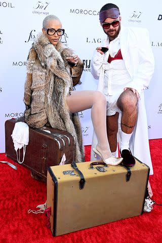 <p>Jon Kopaloff/Getty</p> Doja Cat and Brett Alan Nelson at Daily Front Row Fashion Los Angeles Awards