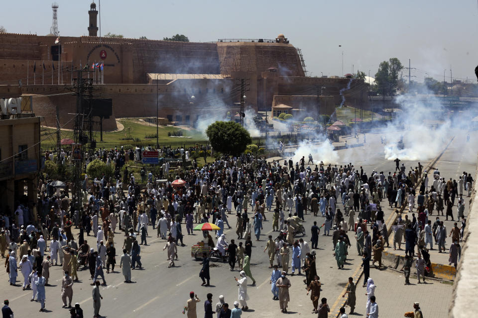 Supporters of Pakistan's former Prime Minister Imran Khan block a road as they protest against the arrest of their leader, in Peshawar, Pakistan, Wednesday, May 10, 2023. Pakistan braced for more turmoil a day after Khan was dragged from court in Islamabad and his supporters clashed with police across the country. The 71-year-old opposition leader is expected in court later Wednesday for a hearing on keeping Khan in custody. (AP Photo/Muhammad Sajjad)