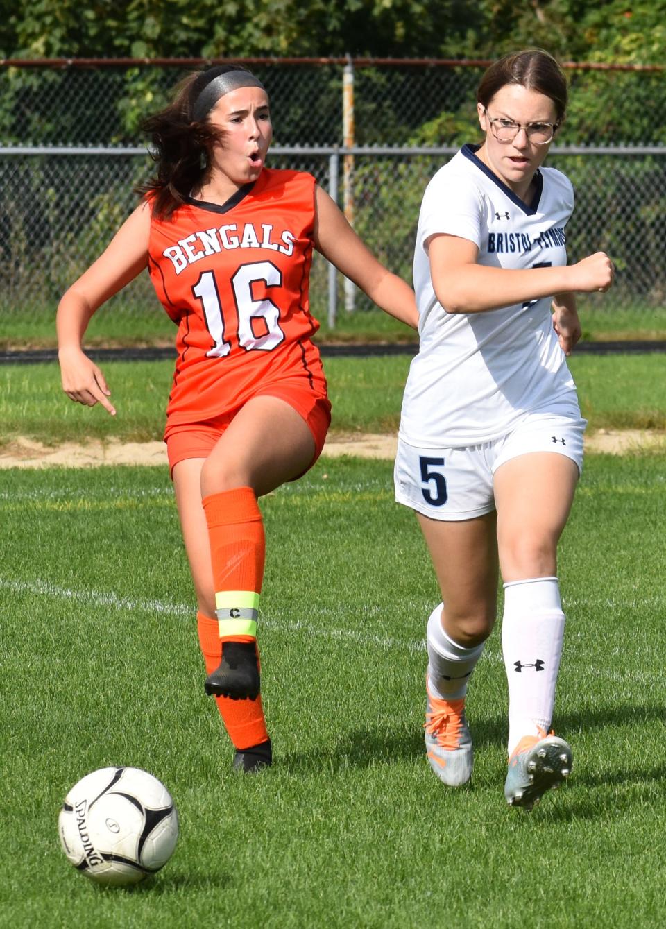 Diman's Kiara Almeida and Bristol-Plymouth's Alexis Frye chase down the ball.