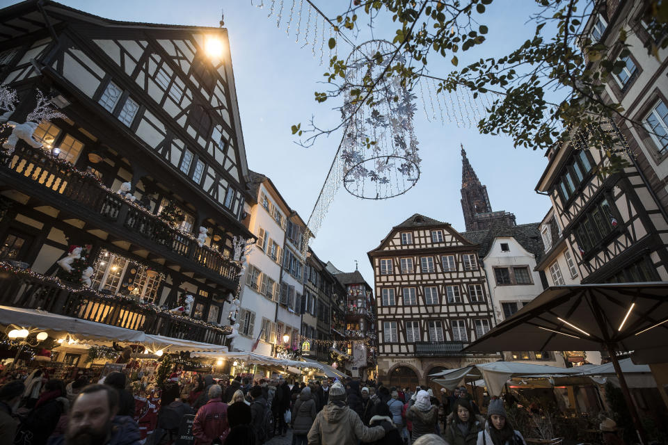 People once against in the streets as Strasbourg's Christmas market reopens under the protection of police, in Strasbourg, France, Saturday Dec. 15, 2018. French police shot and killed the man who they believed attacked Strasbourg's Christmas market on Tuesday killing four people. (AP Photo/Jean-Francois Badias)