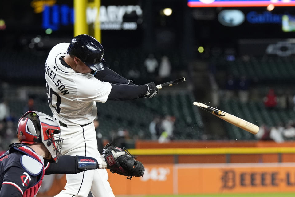 Detroit Tigers' Spencer Torkelson breaks his bat as he gets a RBI single to right during the fifth inning of a baseball game against the Minnesota Twins, Friday, April 12, 2024, in Detroit. (AP Photo/Carlos Osorio)